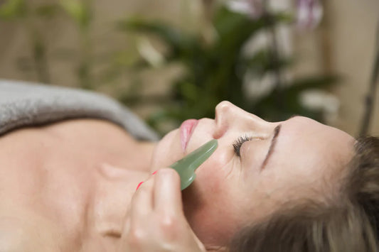 Relaxing facial massage with Gua sha